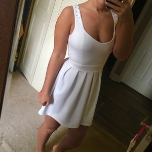 White skater dress with back cutout details